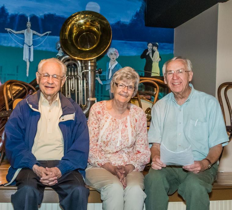 Bix Beiderbecke Museum & Archive organizers (from left) Howard Braren, Geri Bowers, and Carol Schaefer in front of a re-creation of the Hudson Lake stage.